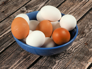 Chicken eggs in a ceramic bowl