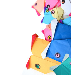 Colorful origami paper fishes isolated white