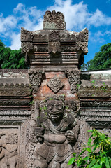Obraz premium Stone wall carving Pura Dalem Penunggekan Temple Bali Indonesia