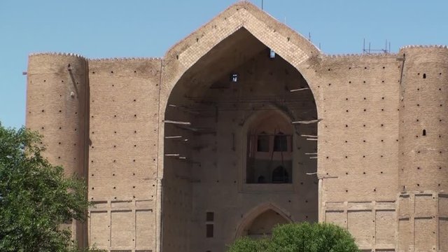 Mausoleum of sufi mystic Khoja Ahmed Yasawi, Turkistan, Kazakhstan. Muslim pilgrims travel Old Silk Road to this ancient Soviet Union republic of Central Asia in ramadan, sing a prayer for god Allah.