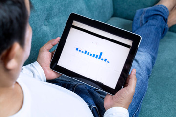 Businessman working from home on tablet and making shopping online order food form mobile on touch screen application. Business delivery service ready meal food and technology concept.