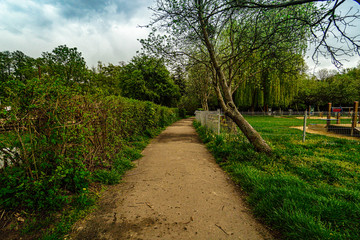 Fototapeta na wymiar Path in the park at Rusalka lake in Poznan (Posen), Poland