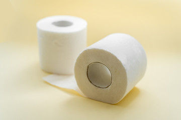 Toilet paper on a yellow background