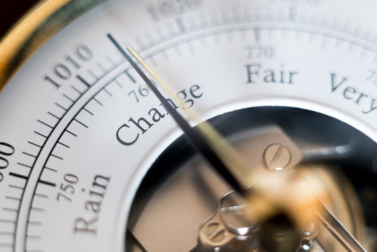 needle of a barometer pointing at the word change. close up of the word