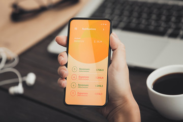 Close up of woman showing screen with account balance