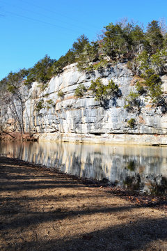 Bluff and reflection on the Buffalo National River, Arkansas, USA vertical