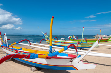 Jukung fishing boats on beach at Sanur Bali Indonesia
