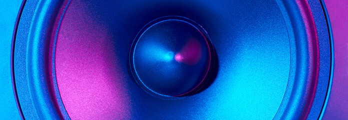 Sound audio speaker with neon lights, long banner. Dynamic monitor close up. Creative backgroound