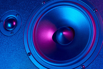 Sound audio speaker with neon lights. Dynamic monitor close up. Creative backgroound