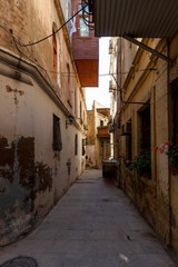 Fototapeta na wymiar Azerbaijan, Baku, Icheri Sheher streets of the old city, color and ordinary life of citizens. Balconies, alleys, terraces, narrow walkways
