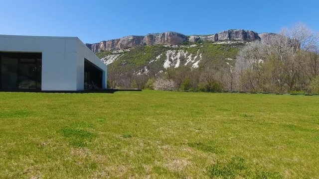 Aerial view. Villa with pool in the mountains. View of the forest and mountains
