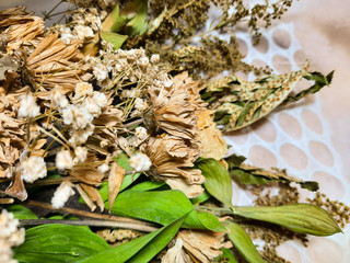 dried leaves on a white tablecloth