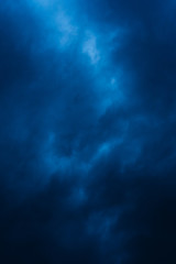 Naklejka na ściany i meble Blue storm clouds on a rainy day