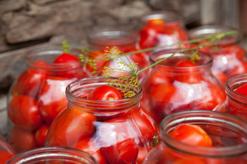 Fototapeta na wymiar Pickling (canning) the tomatoes.