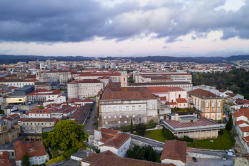 Naklejka na ściany i meble Coimbra drone aerial of beautiful buildings university at sunset, in Portugal