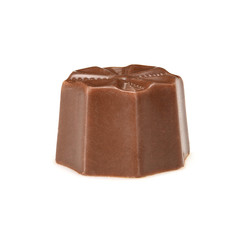 Chocolate pralines. Dark chocolate bonbon with toffee fillings, macro close up isolated on white background.