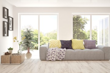 Fototapeta premium White minimalist living room with sofa. Scandinavian interior design. 3D illustration