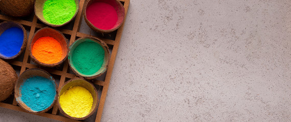 Powder in coconut in stand for Holi