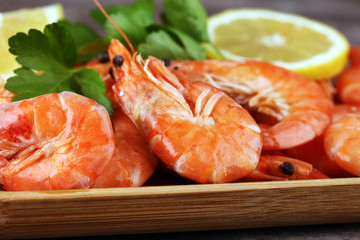 Raw fresh Prawns Langostino Austral. shrimp seafood with lemon and spices on background