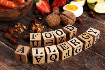 Allergy food concept. Allergy food as almonds, milk, cheese, strawberry, seeds, eggs, peanuts and...