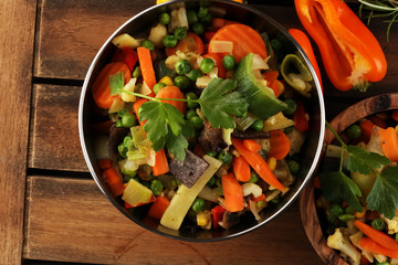 stir fried vegetables from a chinese wok in a bowl with carrot and mushrooms