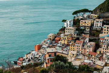Obraz premium View of Riomaggiore from the top of the hill. Old village of Cinque Terre National Park in Liguria, Italy