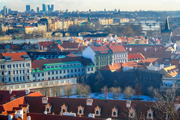 View of the city and city streets, architecture and roofs houses from above. Prague,