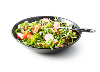 Fresh arugula salad with radishes, tomatoes and red peppers.