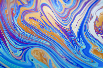 Soap bubble creates a colorful and psychedelic, rainbow palette with swirls and waves