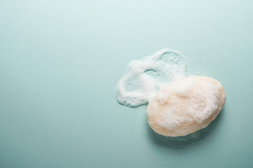 Soap and foam on a light background with place for text.