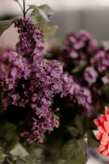 Beautiful spring flower bouquet. Lilacs, daisy, aster flowers. green leaves. White, lilac, purple, pink colors. Amazing flowers in vase. Spring mood time. Summer bouquet. Small and large patals.