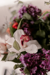 Beautiful spring flower bouquet. Lilacs, daisy, aster flowers. green leaves. White, lilac, purple, pink colors. Amazing flowers in vase. Spring mood time. Summer bouquet. Small and large patals.