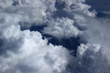 View of clouds from the aircraft's porthole in flight