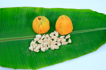 Fresh cocoa nuts isolated on banana leaf