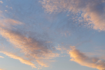 Fototapeta na wymiar Purple-magenta clouds. Cirrus cloudscape on blue sky.Tragic gloomy sky. Landscape with bloody sunset. Fantastic skies on the planet earth.