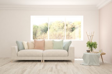 Fototapeta premium Stylish room in white color with sofa and autumn landscape in window. Scandinavian interior design. 3D illustration