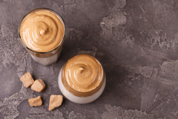 whipped dalgona coffee with milk and cane sugar. South Korean summer drink