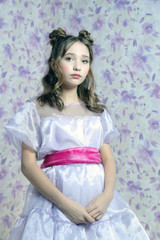 little girl in a dress looks like a doll