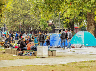 Serbia; Belgrade; August 23, 2015: Syrian Refugees and Migrants Waiting  at beautiful ambiance Park in Belgrade, Serbia.