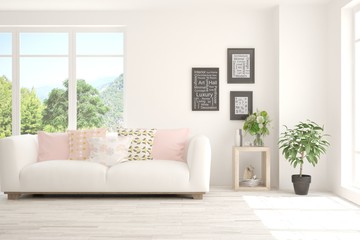 Fototapeta premium White living room with sofa and summer landscape in window. Scandinavian interior design. 3D illustration