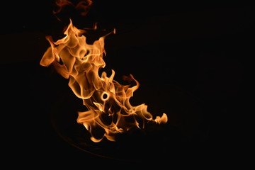 Saint Petersburg, Russia. March, 8, 2014. Bright flames in hearth on black background photo