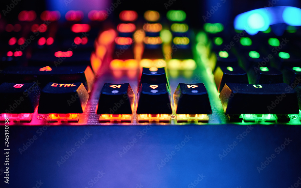 Poster premium gaming rgb led backlit keyboard. mostly red, orange and green. front view.