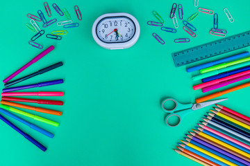 Tools for creativity on a colored background. Watercolor paint. Colored paints and pencils. Back to school. The concept of children's painting. Art. View from above. Space for an inscription. Statione