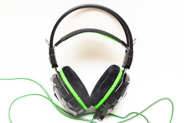 Computer headphones on a white background.A device for listening to audio recordings.