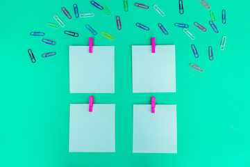 Colorful stationary office equipment or study guide. There are notebooks, scissors, pencils, paper clips of different sizes on a colored background to help or make the recording more organized. Photo 