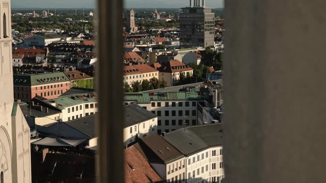 Gimbal shot right to left of Munich St Peter's Church Gothic Cathedral in summer. Gimbal pan shot cathedral shot from Marienplatz