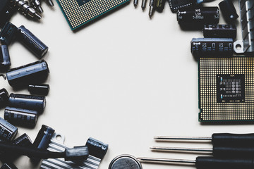 Top view of computer parts and components on white background with copy space in the center. Top...