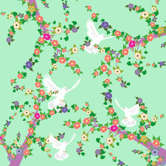 White pigeons fly among flowering branches of trees. Bright spring romantic background.