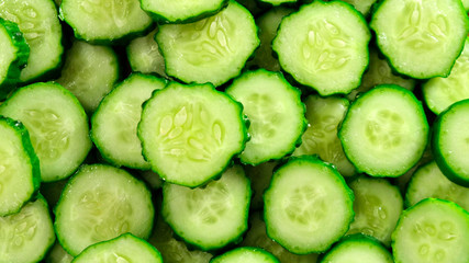 Top view of fresh sliced cucumber rotation. Close up.