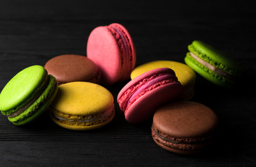 color macaroons on a black background